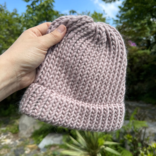 Mink pink hand knitted beanie hat with option to add a pom pom to create a bobble hat
