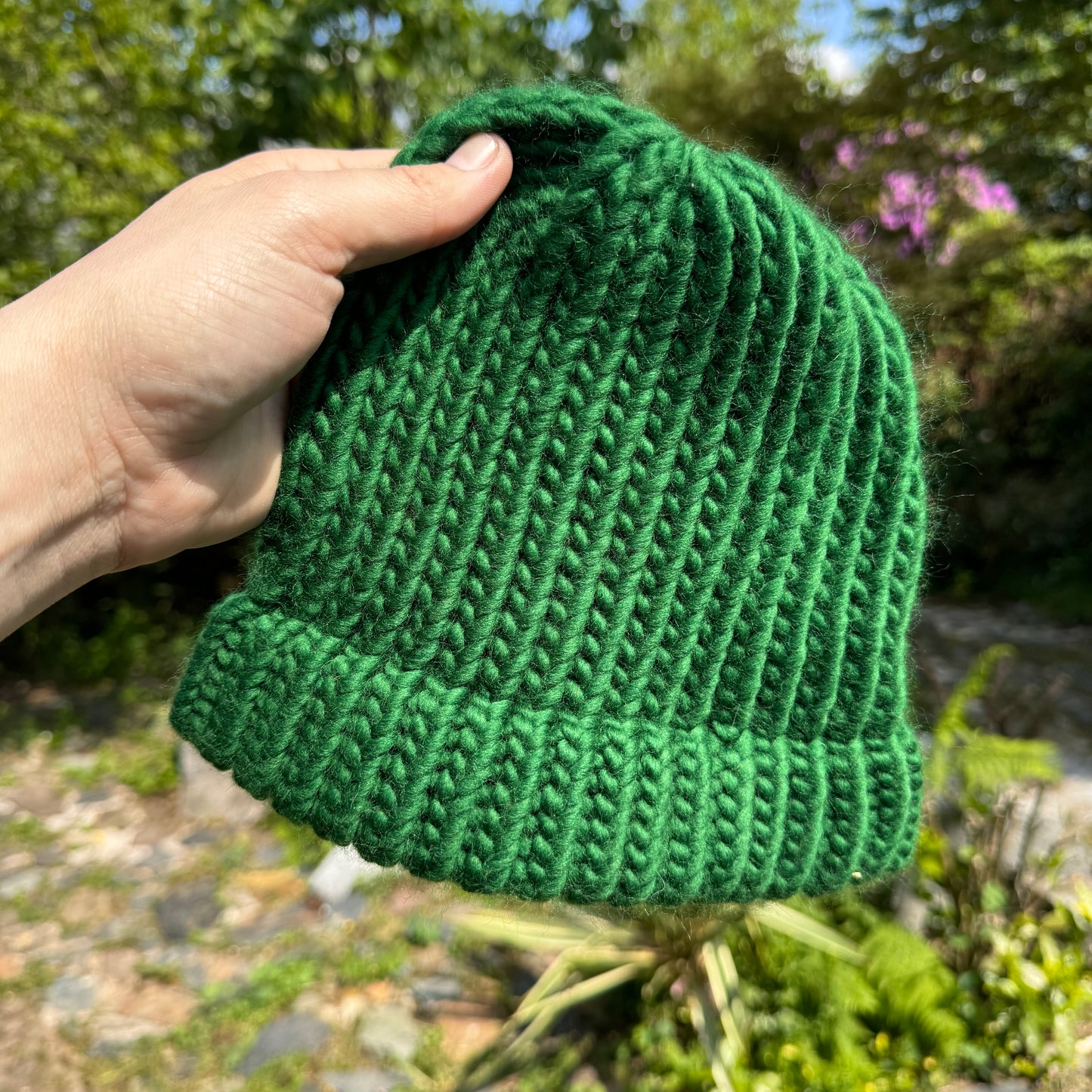 Pine green hand knitted beanie hat. Made in Tamar Valley Cornwall. Chunky knit style hat for outdoor adventures