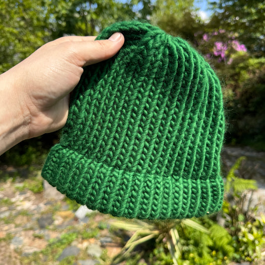 Pine green hand knitted beanie hat. Made in Tamar Valley Cornwall. Chunky knit style hat for outdoor adventures
