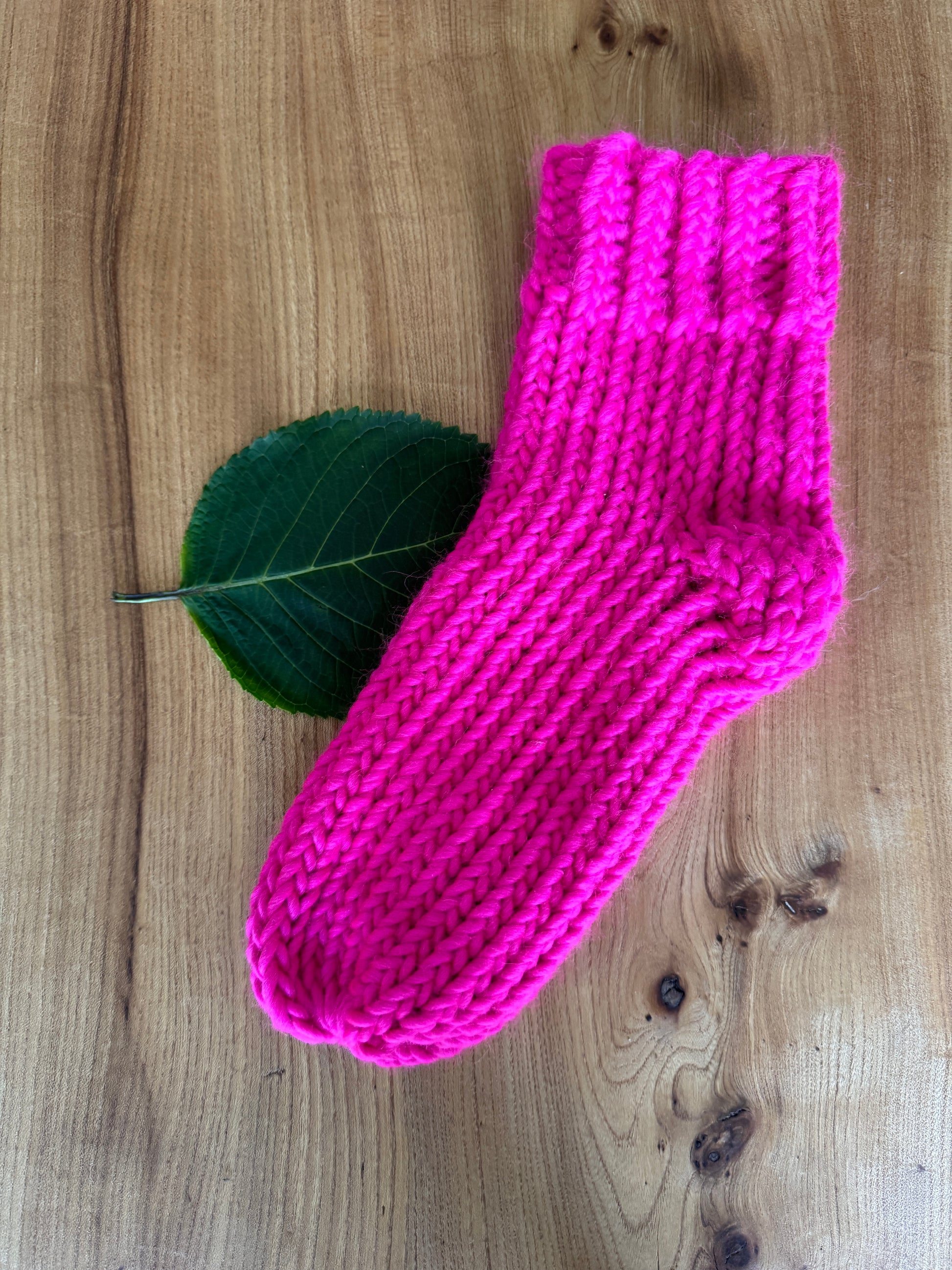 Hand Knitted 100% merino wool socks in bright neon pink by The Dorothy Days knitwear company